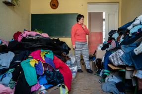 Clothes for migrants are laid out in the classroom of one of the schools in Drohobych