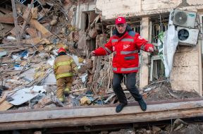 Rescuers dismantle the rubble of a residential building in Kharkiv destroyed after the shelling by the Russian military occupiers