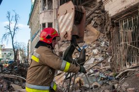 Rescuers dismantle the rubble of a residential building in Kharkiv destroyed after the shelling by the Russian military occupiers