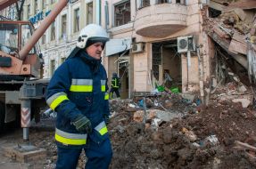 Rescuers dismantle the rubble of a residential building in Kharkiv destroyed after the shelling by the Russian military occupiers