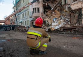 Rescuers dismantle the rubble of a residential building in Kharkiv destroyed after the shelling by the Russian military occupiers