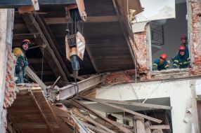 Rescuers dismantle the rubble of a residential building in Kharkiv destroyed after the shelling by the Russian military occupiers