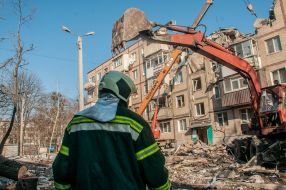 Rescuers dismantle the rubble of a residential building in Kharkiv destroyed after the shelling by the Russian military occupiers