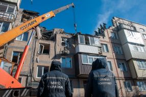 Rescuers dismantle the rubble of a residential building in Kharkiv destroyed after the shelling by the Russian military occupiers