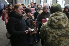 Law enforcement officers are checking documents at the railway station in Lviv