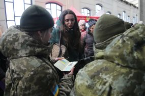 Law enforcement officers are checking documents at the railway station in Lviv