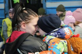 Woman with a boy at the railway station in Lviv
