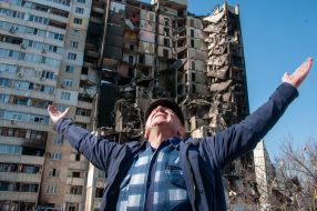 A man near a destroyed house in Kharkov
