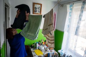 Woman hangs laundry in Drohobych