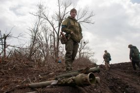 Ukrainian soldier stands near Russian MANPADS "Igla"