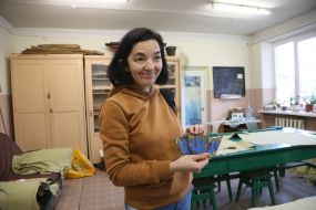 Tatiana Kravets-Starch shows chevrons in a sewing shop in Stryi
