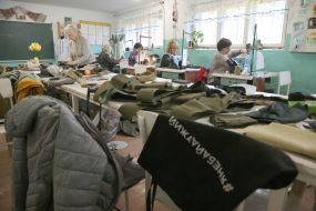 Volunteers sew covers for body armor in a sewing shop in the city of Stryi