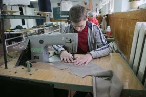 Volunteers sew covers for body armor in a sewing shop in the city of Stryi
