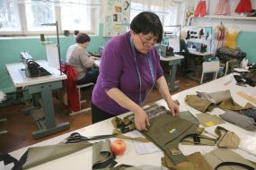 Volunteers sew covers for body armor in a sewing shop in the city of Stryi