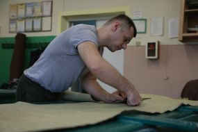 Volunteers sew covers for body armor in a sewing shop in the city of Stryi