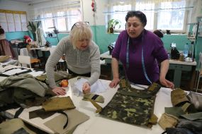 Volunteers sew covers for body armor in a sewing shop in the city of Stryi