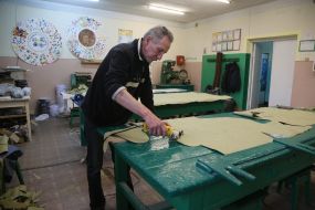 Volunteers sew covers for body armor in a sewing shop in the city of Stryi