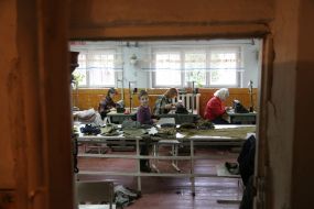 Volunteers sew covers for body armor in a sewing shop in the city of Stryi