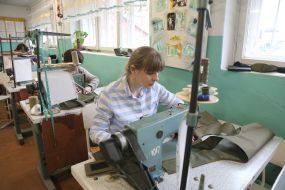 Inna Kotsurova sews a body armor cover in a sewing shop in the city of Stryi