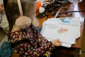 The girl shows a picture