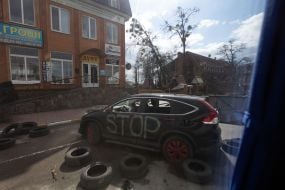 A car destroyed in Bucha as a result of shelling