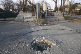 Funnel from the explosion near the monument to the fallen soldiers during World War II in Gostomel