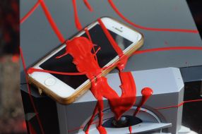 A mobile phone flooded with red paint near the building of the Russian consulate in Lviv