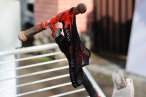 A scooter flooded with red paint near the building of the Russian consulate in Lviv