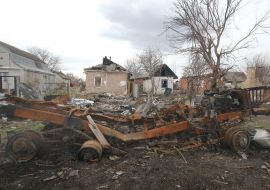 Destroyed houses and burned Russian military equipment