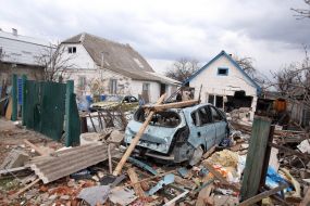 Destroyed houses, car