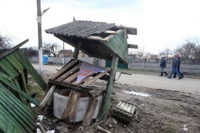 Destroyed fence and well