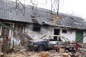 Destroyed houses, car