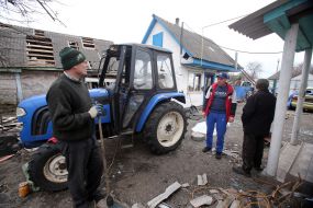 People near a tractor