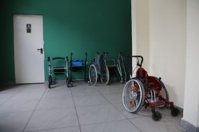 Wheelchairs at the entrance to the shower room at the Refugee Center in Lviv