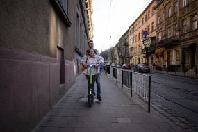 Young couple riding a scooter