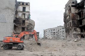 Dismantling the rubble of destroyed houses in Borodianka