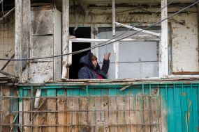 Woman on the balcony of a house in Kharkov