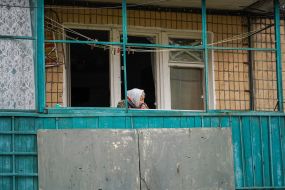 Woman on the balcony of a house in Kharkov