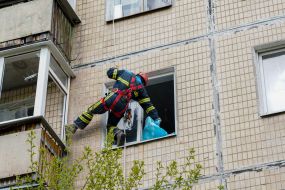 A rescuer is looking for people in a house damaged in the explosion in Kharkiv