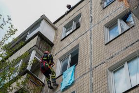 A rescuer is looking for people in a house damaged in the explosion in Kharkiv