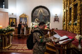 A serviceman is praying in St. Michael Church in central Zhytomyr, Ukraine
