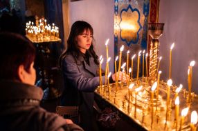 People are praying in St. Michael church in Zhytomyr, Ukraine.