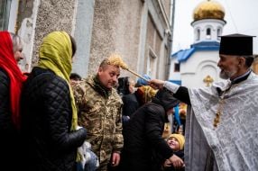 The priest is blessing the easter baskets in the center of Zhytomyr.