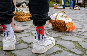 The priest is blessing the easter baskets in Lviv