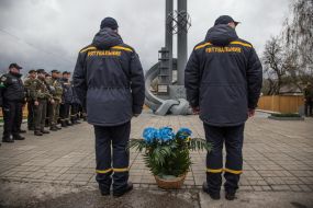 Laying flowers at the monument to "Those who saved the world" in Chernobyl