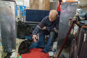 A man with a cat at one of the metro stations in Kharkiv