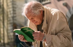 An elderly man with the textbook in Lviv