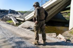 Territorial defense fighter near the blown up bridge