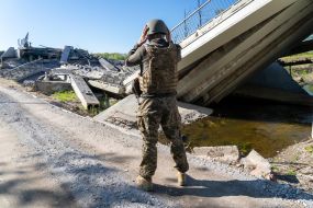 Territorial defense fighter near the blown up bridge