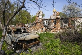 Destroyed building and wrecked car in the village of Lukashivka